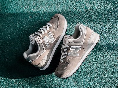 Pair of clean athletic shoes on light grey background